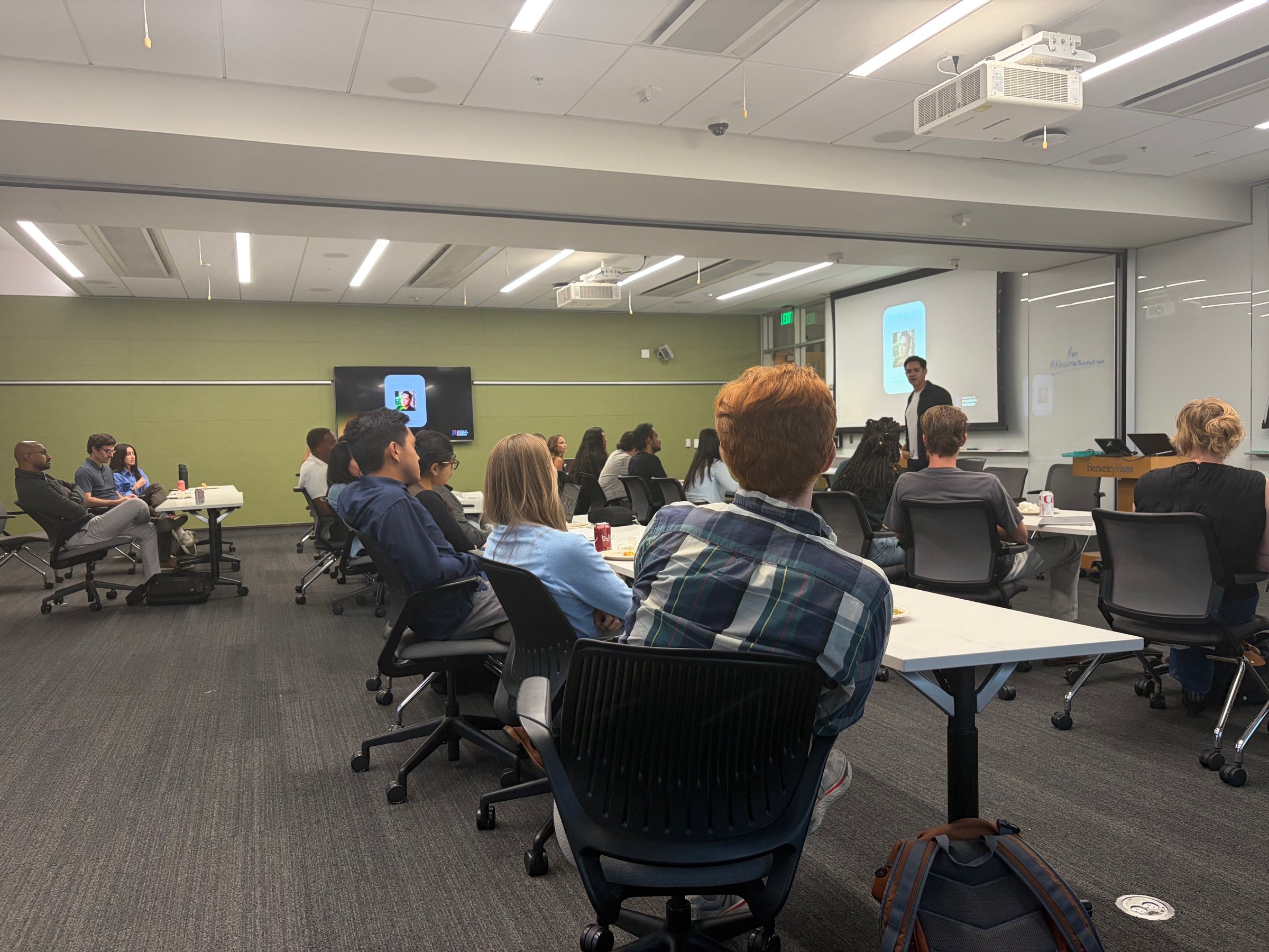 Berkeley Haas students listening to a guest speaker during campus programming